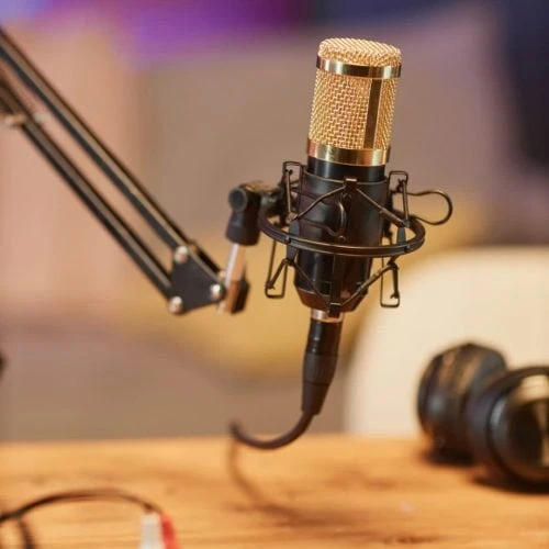 A podcast mic at a table set up