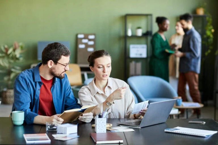 Two co-workers working together
